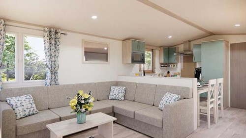 image of caravan manufacturer Regal Holiday Homes' 'Baywater' model, a lounge with pastel blue and grey coloured decor