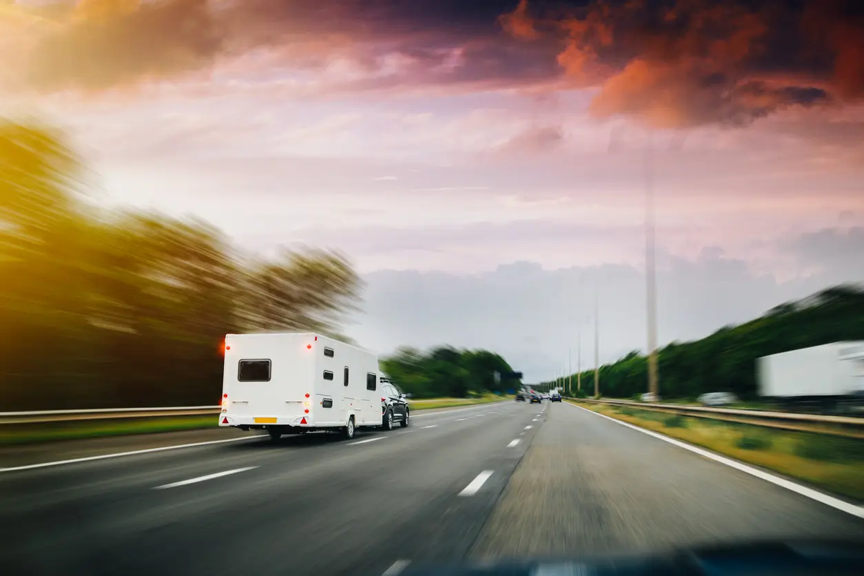 What is the speed limit for towing a caravan?