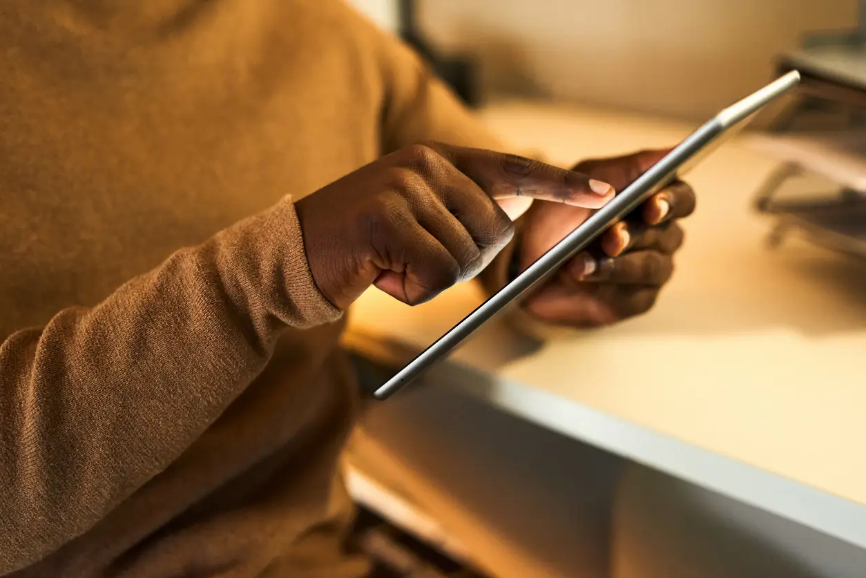 Person on a tablet at a desk
