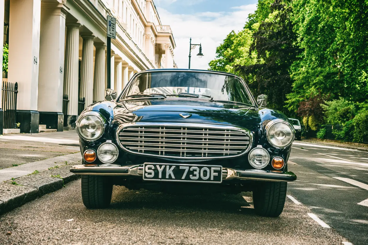 front of a classic car with a black and silver number plate