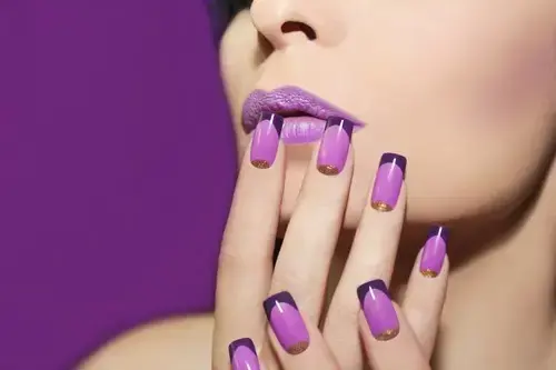 woman's face and hands with purple colour block nails