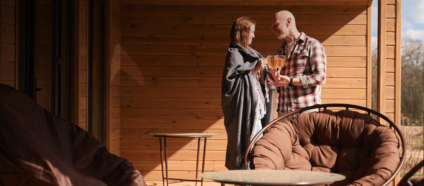 Couple standing outside of a chalet