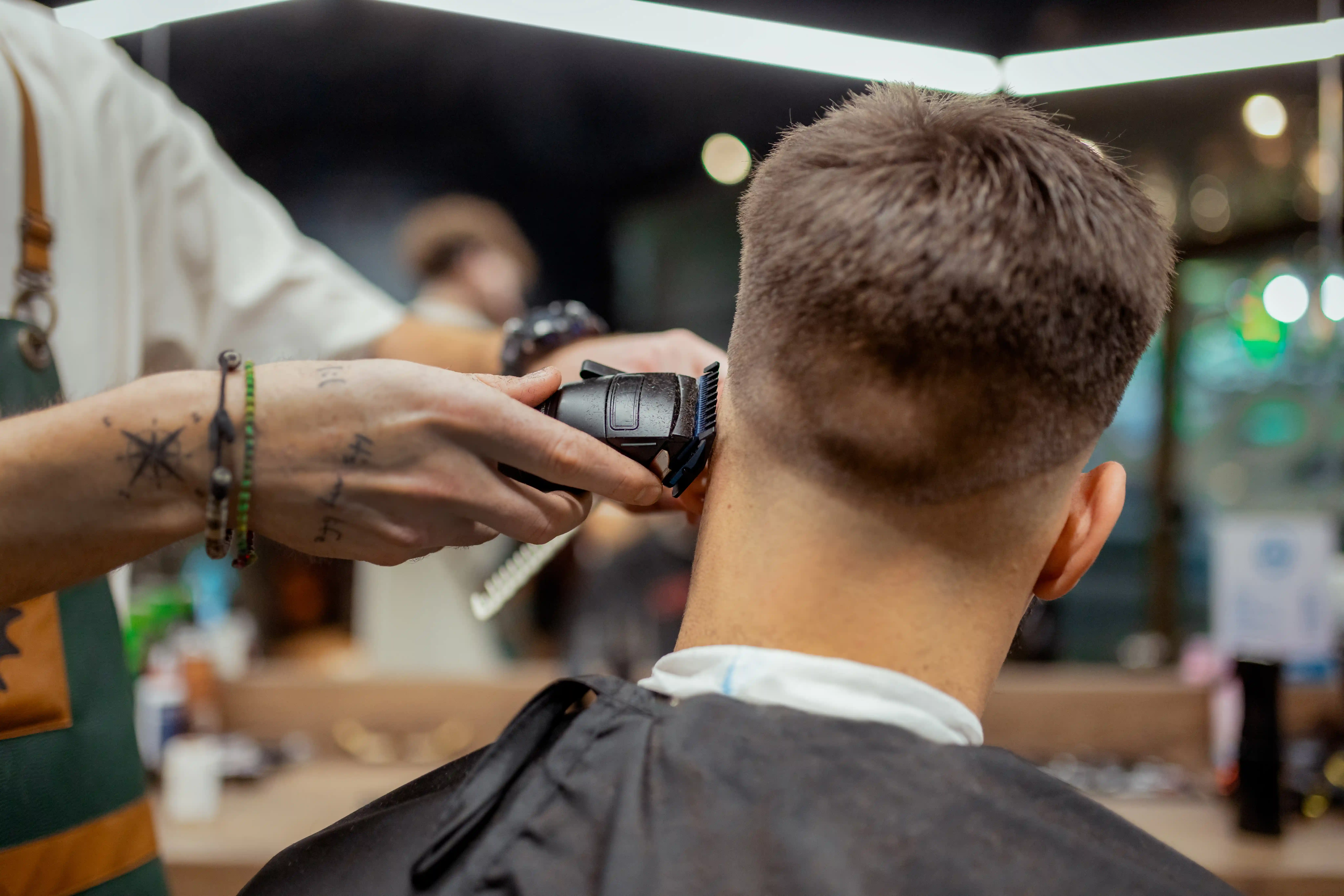 Barber using a hair clipper