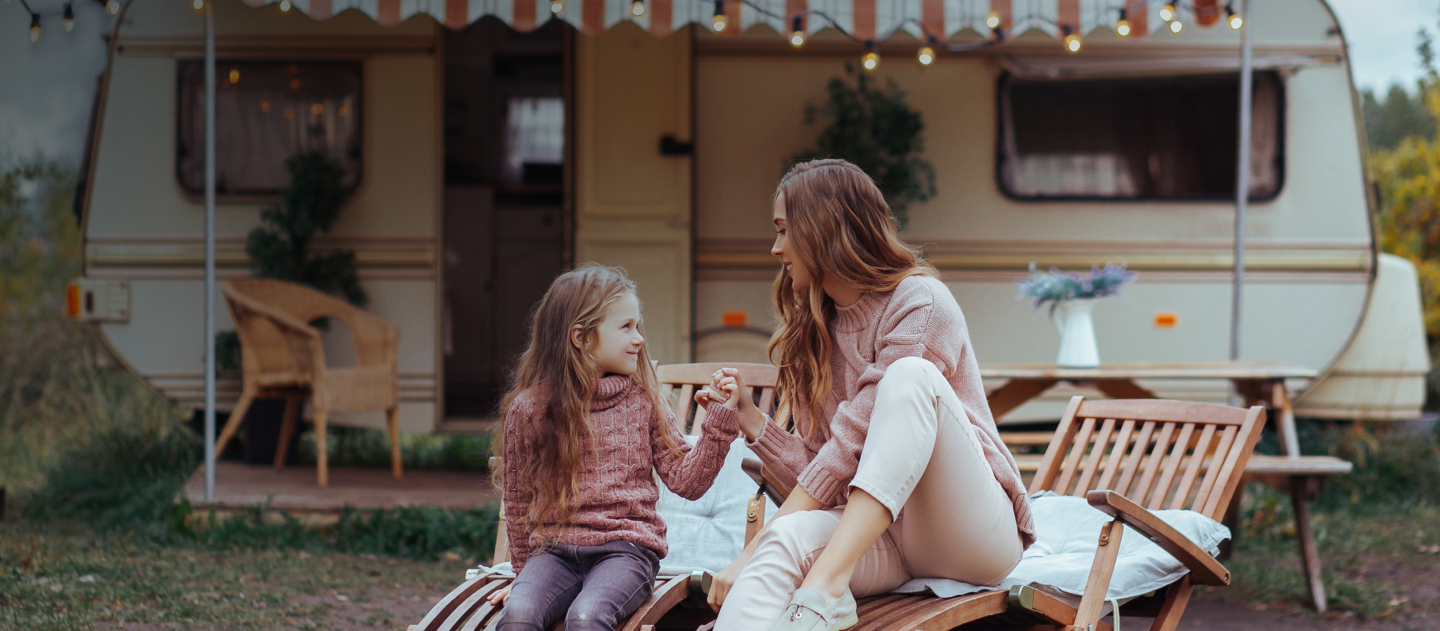 woman engages with child upon a chair
