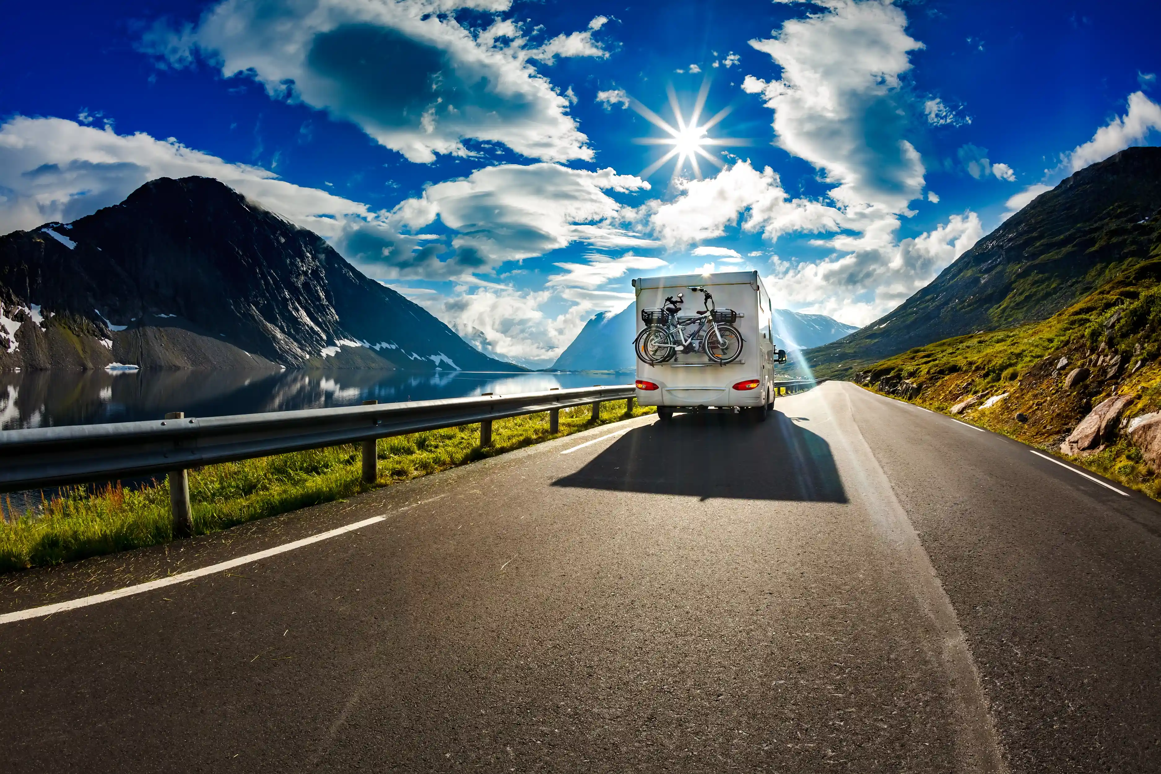 Caravan driving on a road in the sunshine