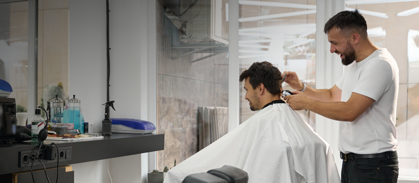 Barber cutting a client's hair