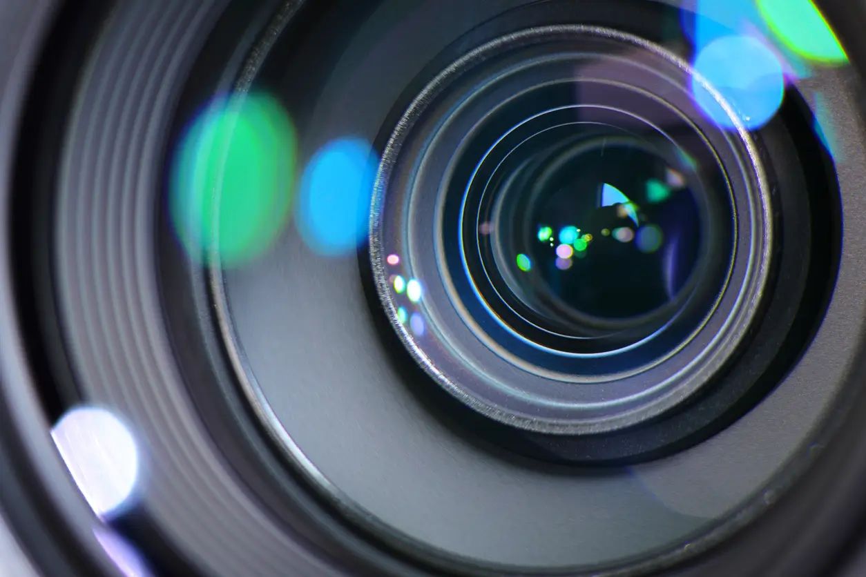 Close up of a camera lens with shutter open