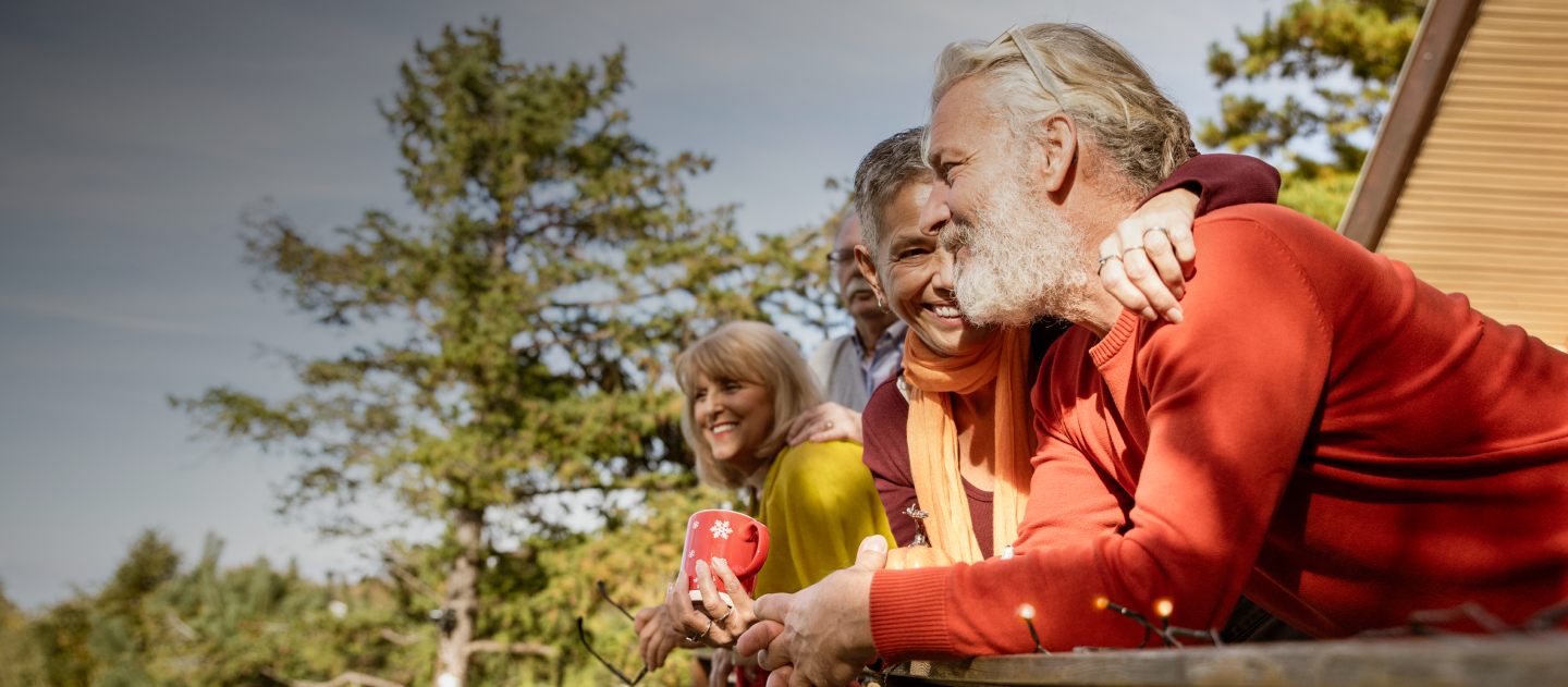 men outside a holiday lodge