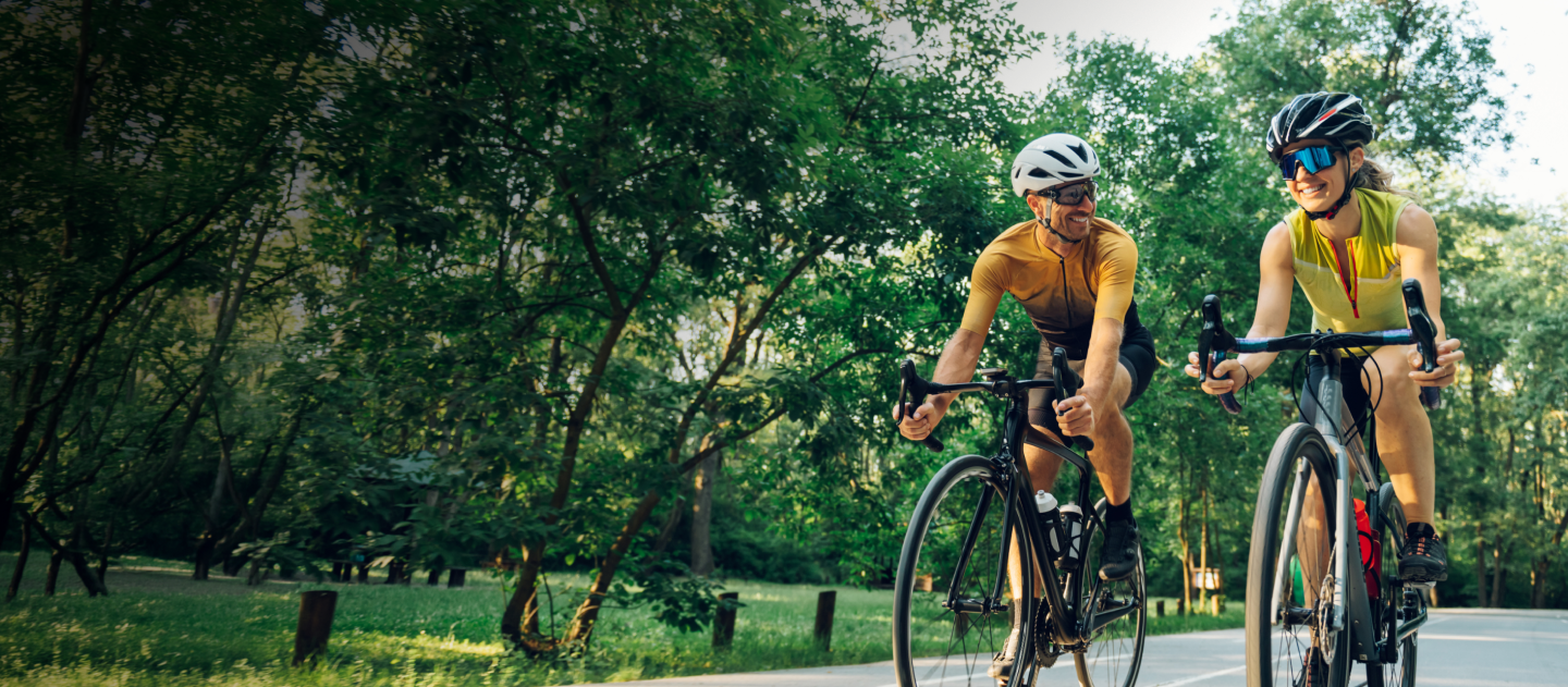 Two people enjoying riding their bikes
