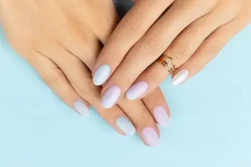 woman's hands with ombre nails